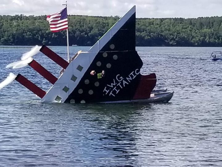 IWG Titanic replica boat sinking display on lake